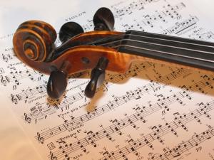 IMAGE: violin resting on a musical score