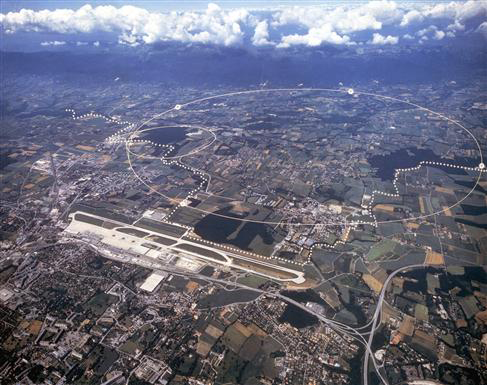 Aerial view of the CERN site just outside Geneva. The underground particle accelerators (with circumferences of  27 km and 7 km) allow scientists to look at tiny scales.    Image &copy; <a href='http://public.web.cern.ch/Public/Welcome.html'>CERN</a>.